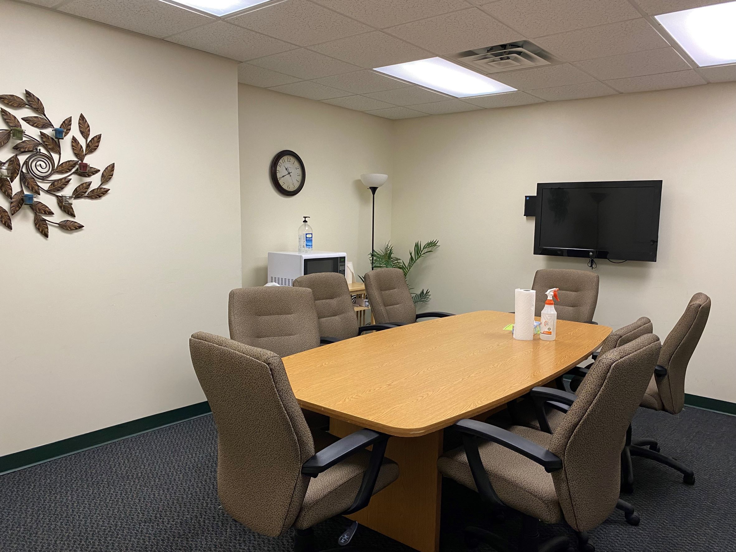Small conference room with table and chairs