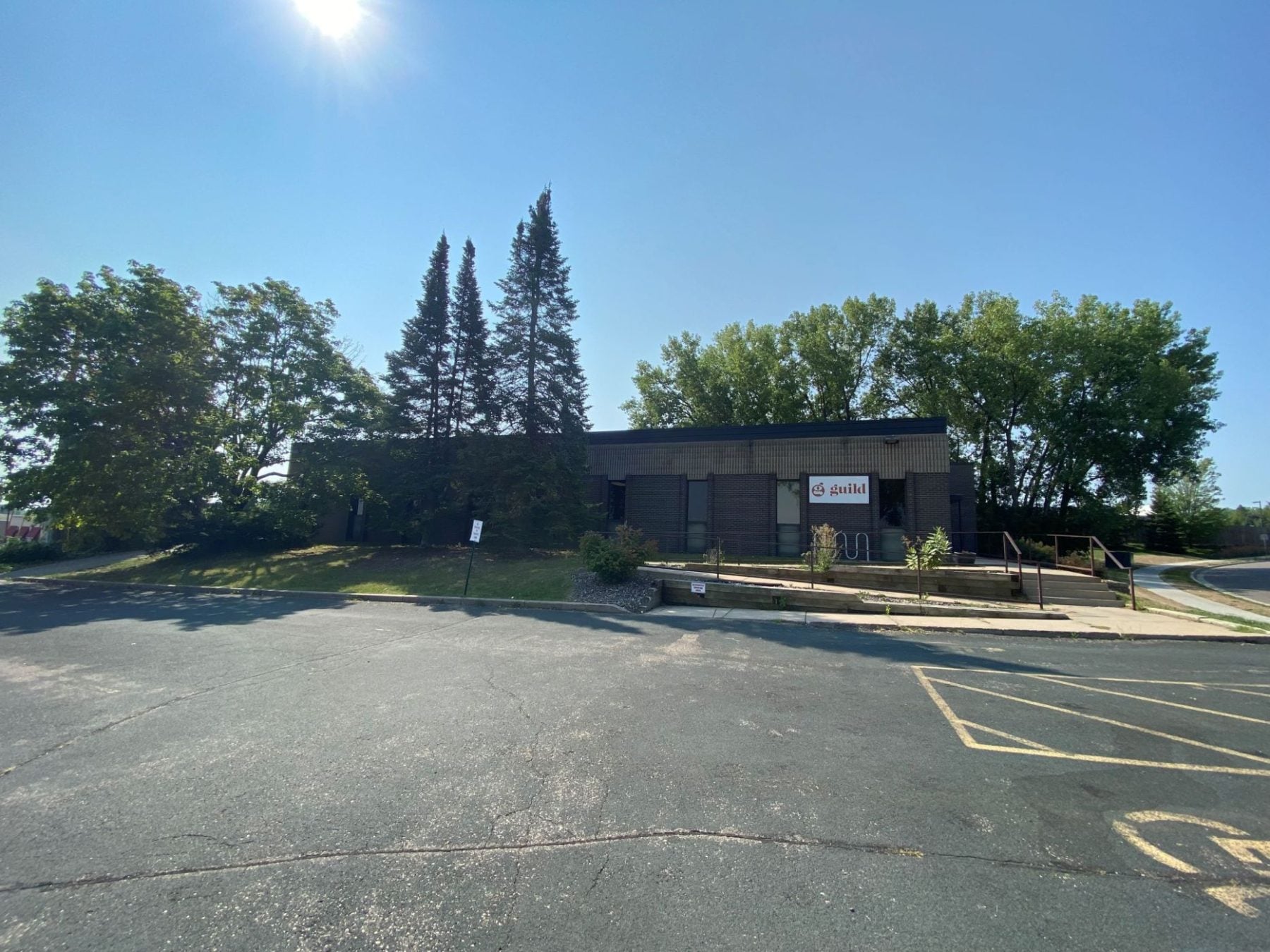 A building with trees in the background.